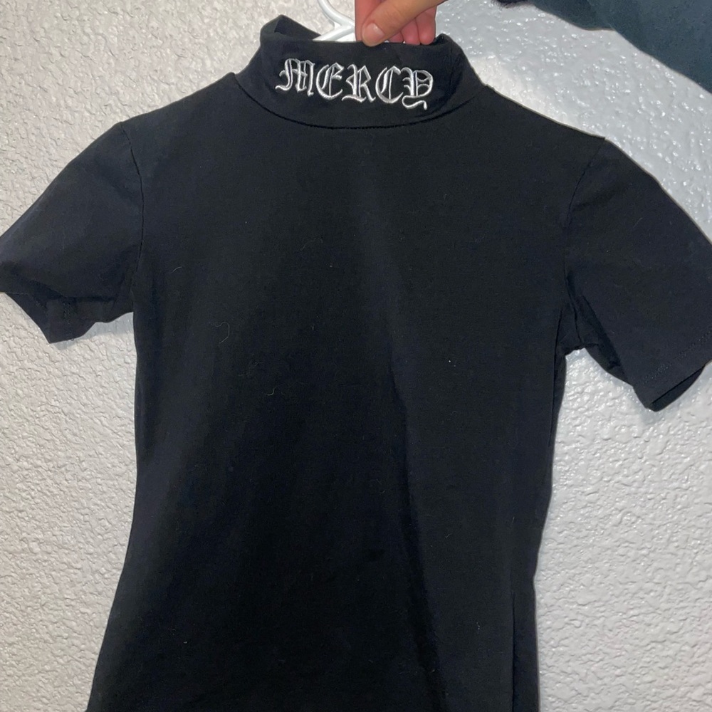 black “mercy” shirt